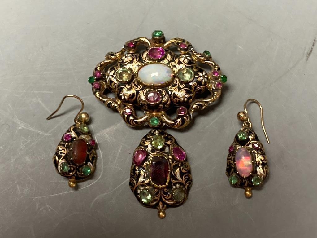 A Victorian yellow metal, enamel and multi gem set suite of jewellery (adapted), comprising a drop pendant brooch and pair of earrings